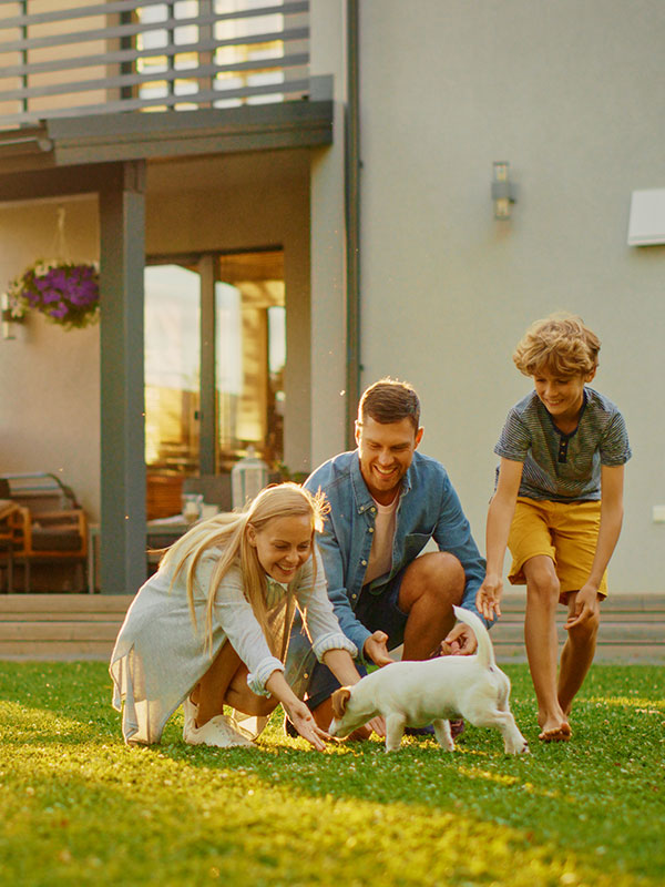 Happy Family Outdoors with dog