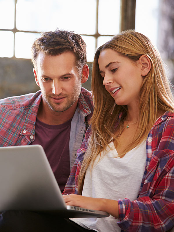 Couple browsing hot water systems online